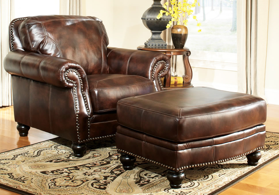 living room with leather ottoman