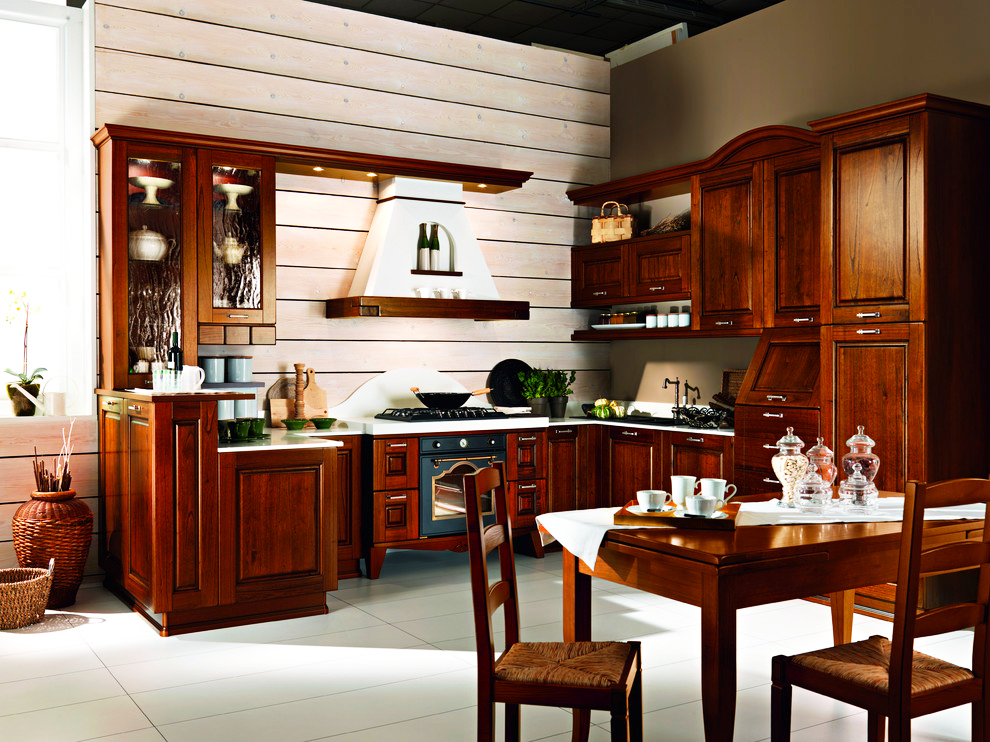 italian style kitchen with orange wall